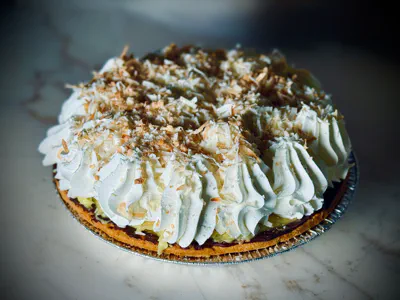 Classic coconut cream pie with whipped topping